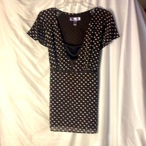 Brown and white polka dot blouse.